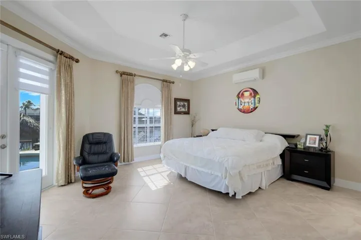 Primary bedroom with french doors to lanai