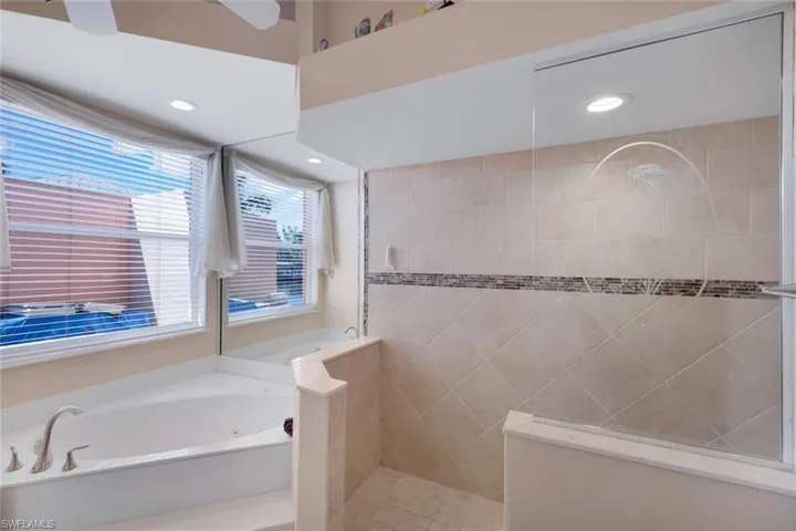 Primary bathroom with separate shower and jetted tub