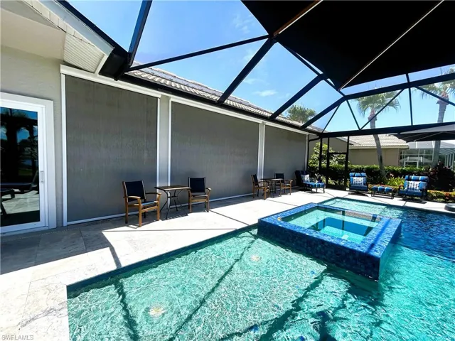 View of pool featuring an in ground hot tub, a lanai, and a patio area CAN'T SEE IN