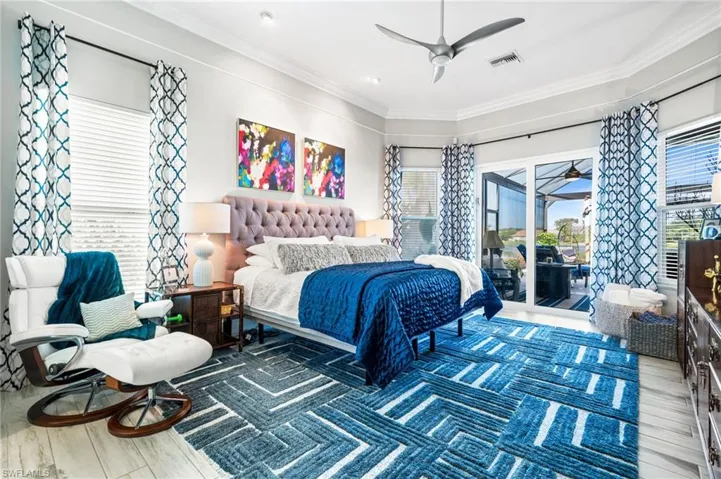 Bedroom featuring access to exterior, ornamental molding, ceiling fan, and hardwood / wood-style floors