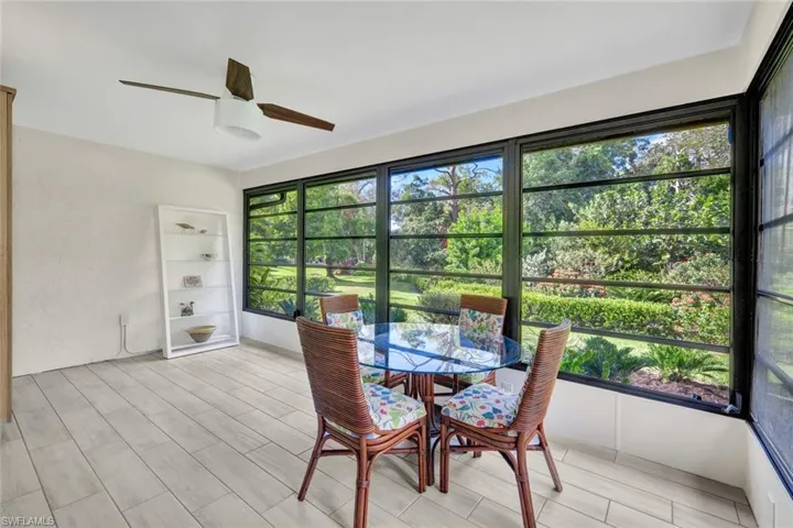 Spacious and bright.  This tiled lanai is partly furnished and comes with a ceiling fan.