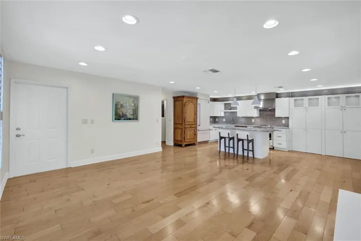 Take a look at this great room. It is your canvas to compete the your won look and furnishings. The pretty antique wood cabinet shown can be used for storage, moved, or eliminated if it doesn't fit your taste.