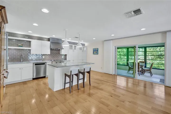 The custom kitchen is ready for you to enjoy. The stainless steel appliances complete the upscale look.