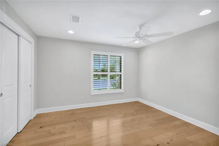 The 2nd bedroom is unfurnished.  It is a good size, has a ceiling fan, built in closet organizers, and beautiful maple floors.