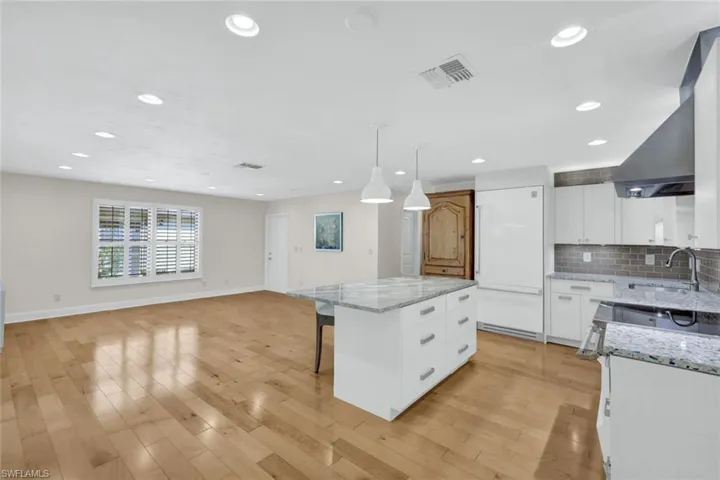 Pendant lighting over the island and a stunning great room with hardwood maple floors. There is plenty of room to set up your desired furniture arrangement and room for your table in the eat-in kitchen.