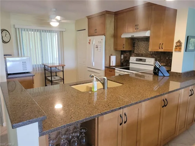 New wood cabinets,quartz counters, Blanco sink and new faucet. Stove has 2 ovens for making Thanksgiving meals easier. Pantry and base cabinets offer additional storage.
