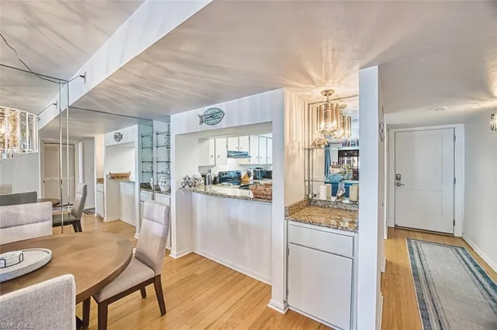 Dining space featuring a chandelier and light wood-type flooring