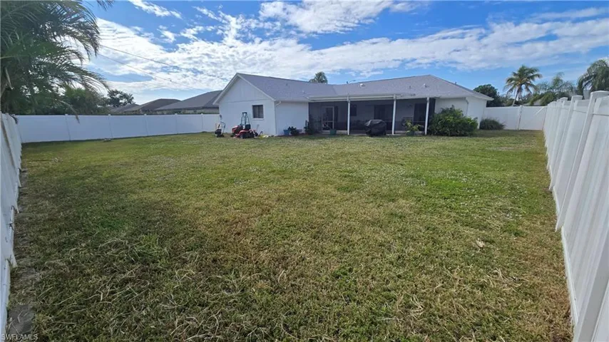 View of yard with a screened porch