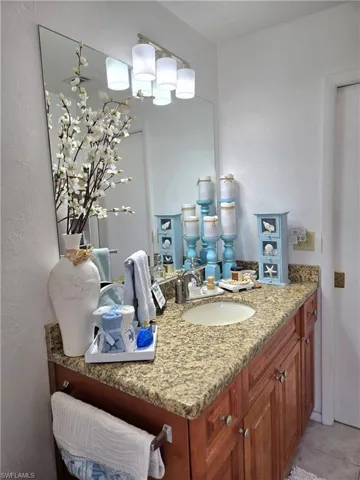 Bathroom with vanity and tile patterned flooring
