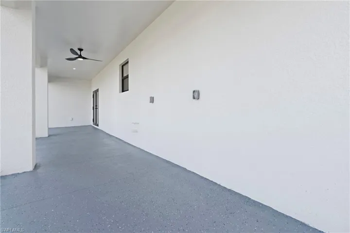 Hallway with speckled floor