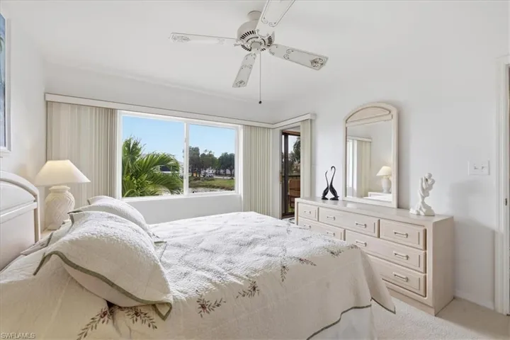 Bedroom featuring ceiling fan and light colored carpet