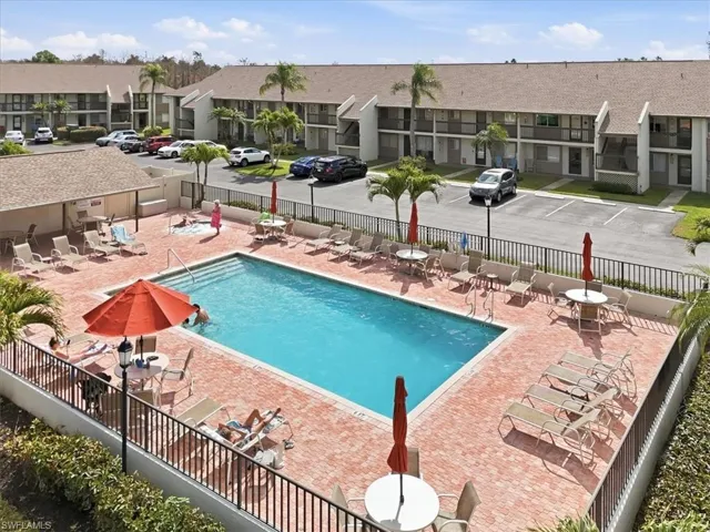 Community pool with a patio