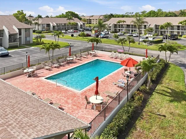 Community pool with a patio