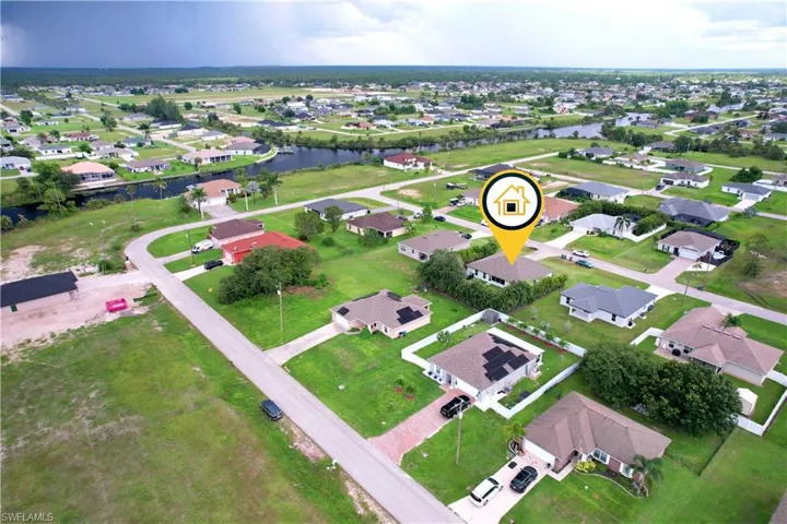 View of property location featuring nearby suburban area and a nearby body of water