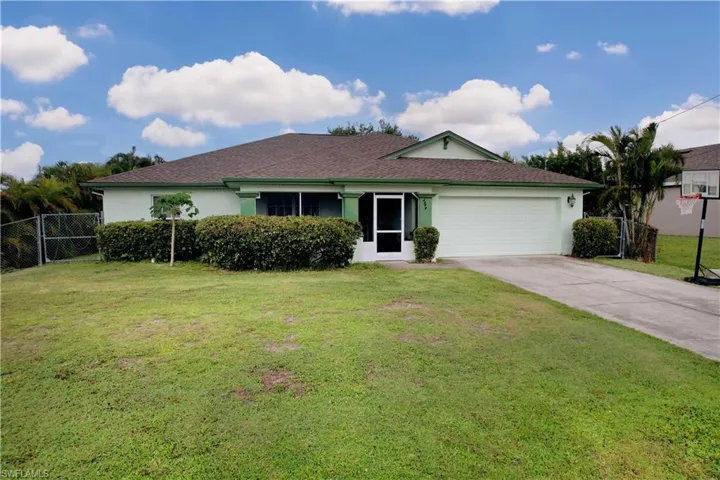 Ranch-style home with stucco siding, a garage, concrete driveway, and a shingled roof