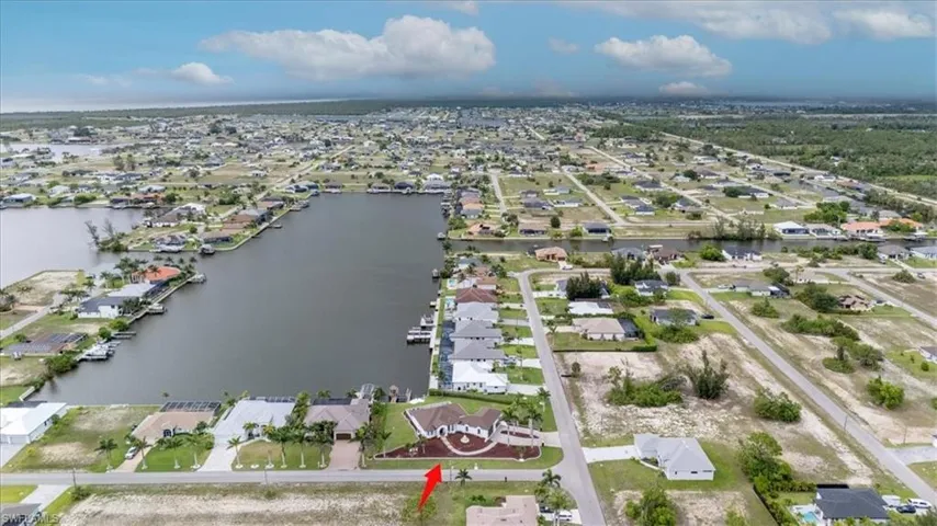 View of property location featuring nearby suburban area and a nearby body of water