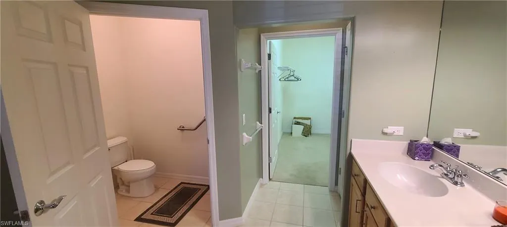 Bathroom with vanity and light tile patterned floors