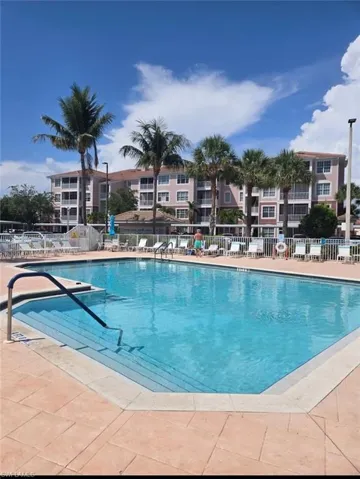 Community pool with a patio area