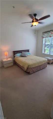 Bedroom featuring carpet floors and ceiling fan