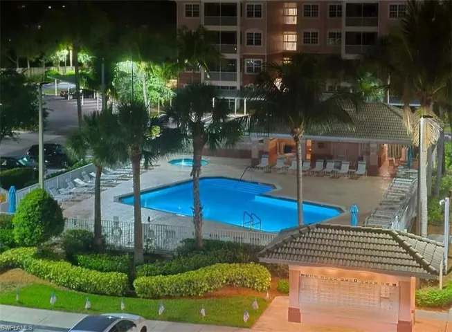 Community pool featuring a patio