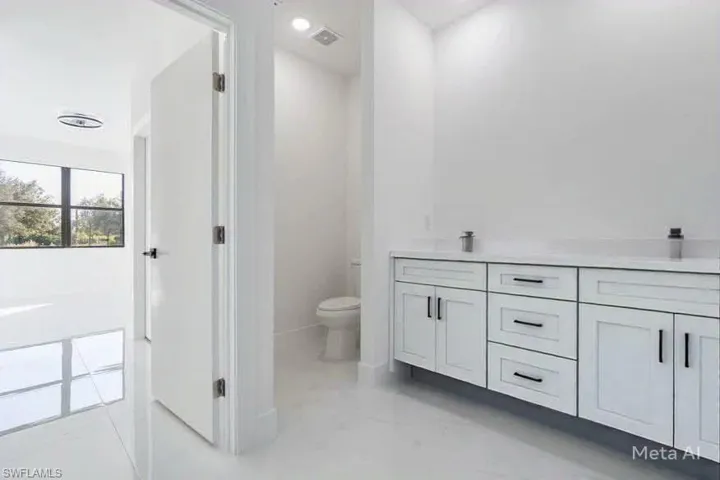 Bathroom with vanity and toilet