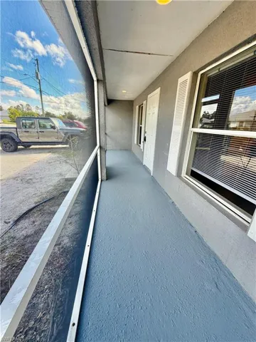 Balcony featuring a sunroom