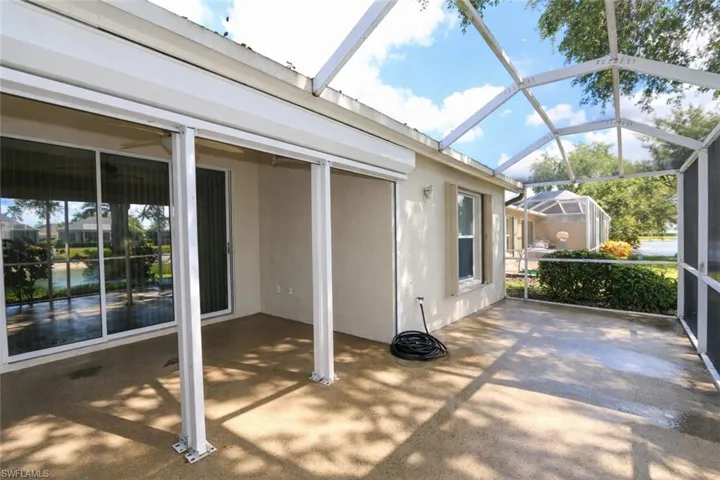 View of patio / terrace with glass enclosure and a sunroom