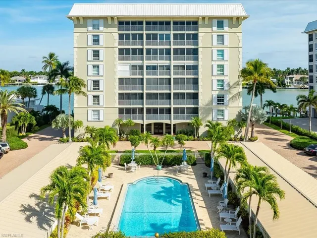 Community pool featuring a water view
