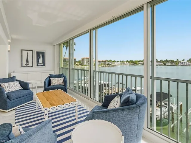 Sunroom / solarium with a water view