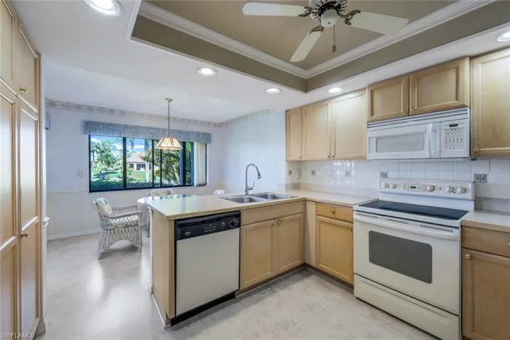 Spacious Kitchen, Wood Cabinetry, Laminate Flooring