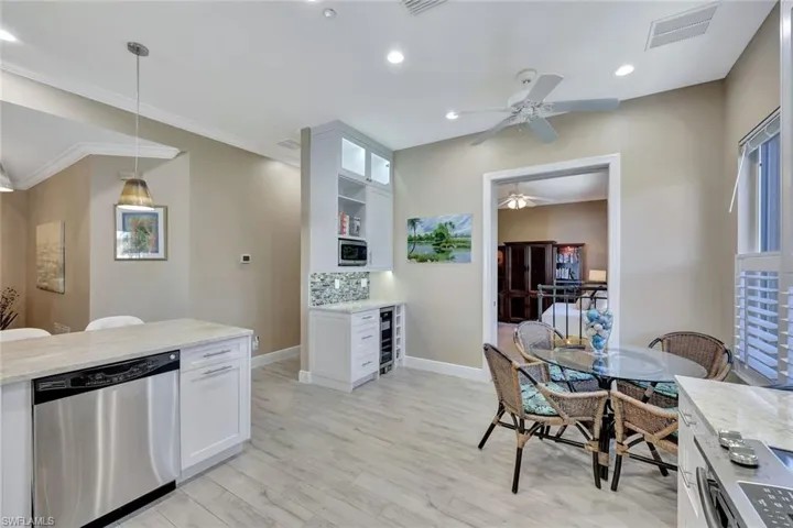 Kitchen with pendant Updated kitchen with lighting over pennisula that works like an Island. Taj Mahal Granite.