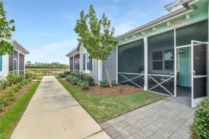 View of home's exterior featuring a sunroom and board and batten siding