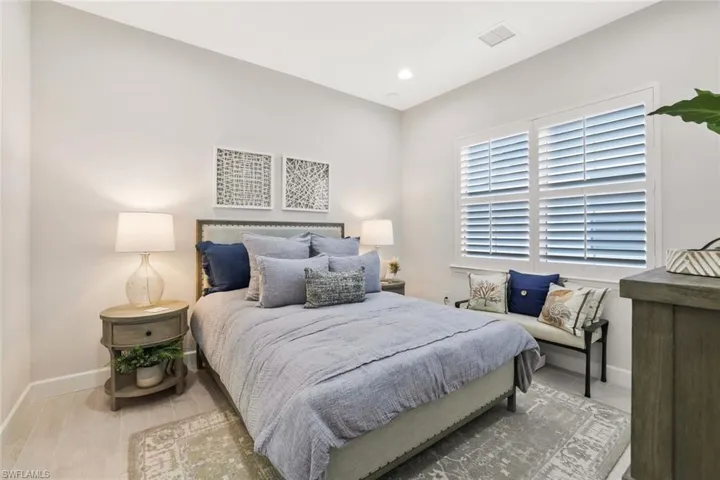 Bedroom featuring light wood finished floors and recessed lighting