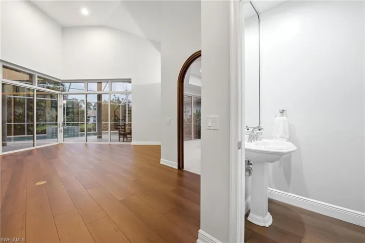 Powder Bathroom by foyer entering the family room. Zero corner sliders