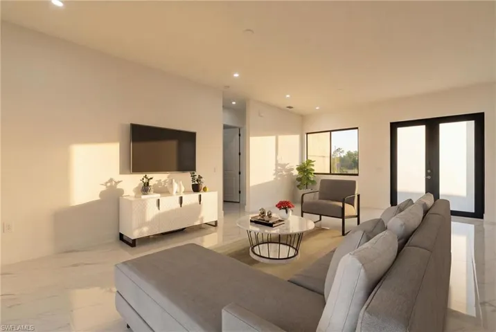Living room with light marble finish flooring, french doors, and recessed lighting