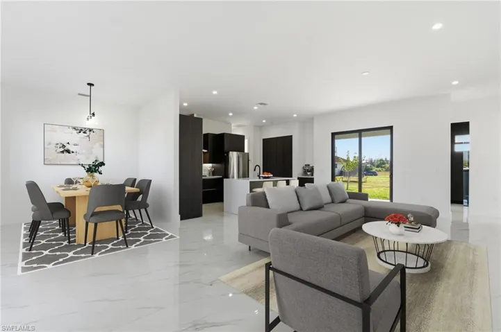 Living room featuring light marble finish floors and recessed lighting