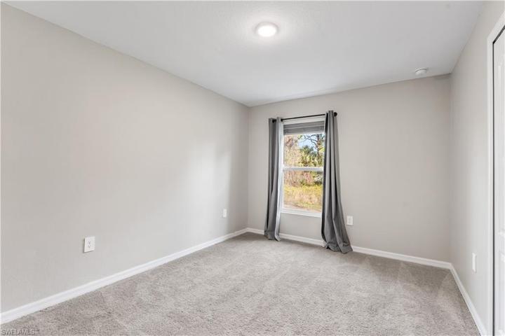bedroom 2 with views to the back yard