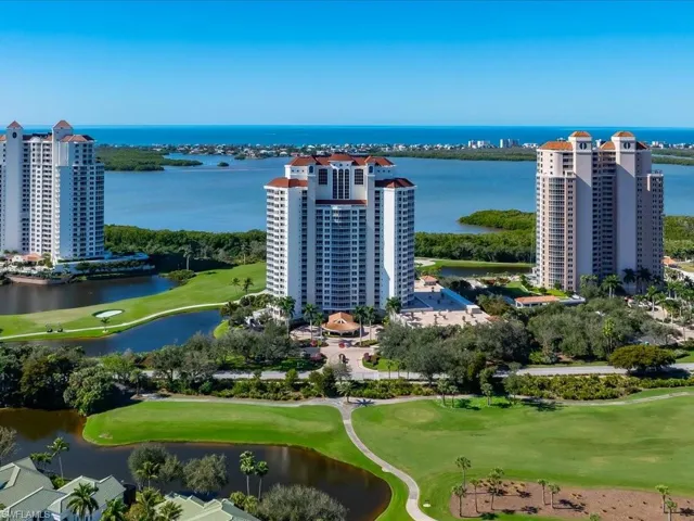 Bird's eye view of a large body of water and a local golf course