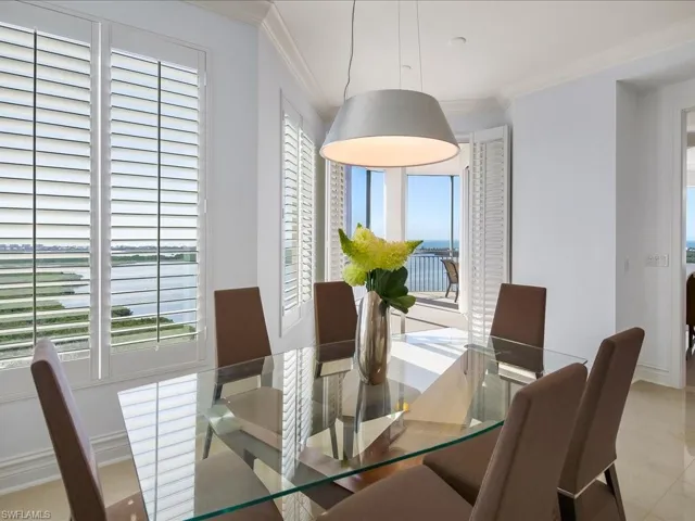 Dining area featuring crown molding