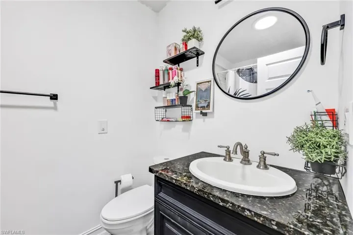 Bathroom with vanity and curtained shower
