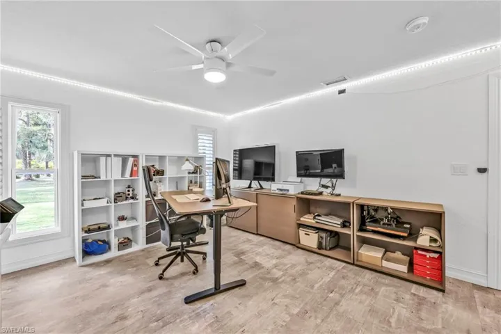 Office space featuring light wood-style floors and ceiling fan