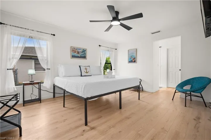 Bedroom featuring light hardwood / wood-style flooring and ceiling fan