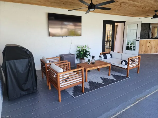 View of patio / terrace with ceiling fan, french doors, and an outdoor hangout area
