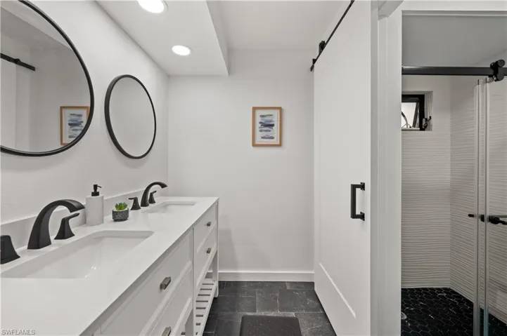 Bathroom featuring vanity and walk in shower