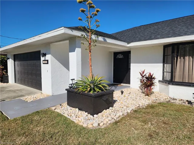 View of exterior entry featuring a garage