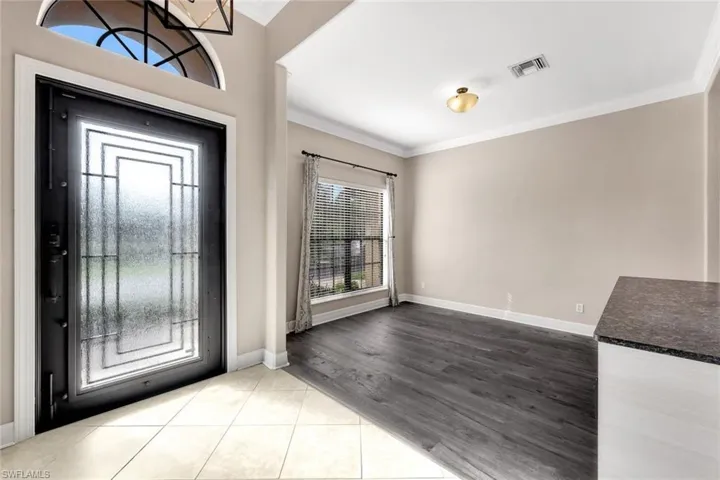 Entryway with hurricane iron door.