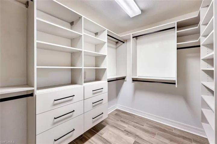 Walk in closet with custom California closets