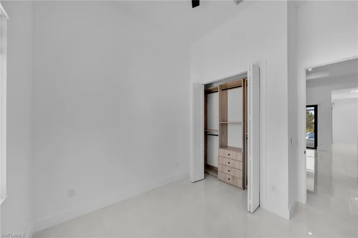 Unfurnished bedroom with baseboards and a closet