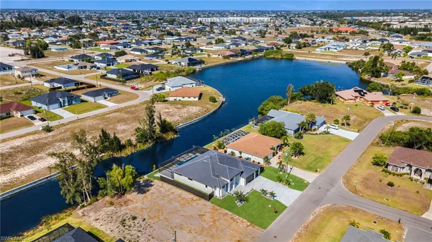 Bird's eye view featuring a water view and a residential view