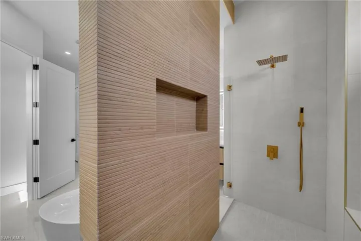 Hallway featuring tile patterned floors and recessed lighting